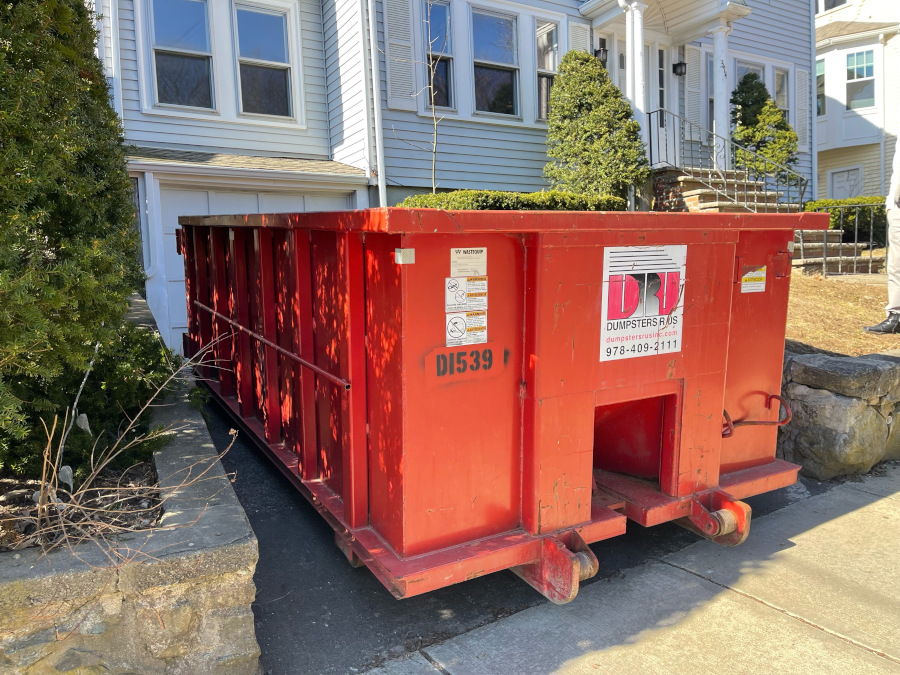 15 yard ABC dumpster delivery in Arlington MA for a stonewall and walkway repair.