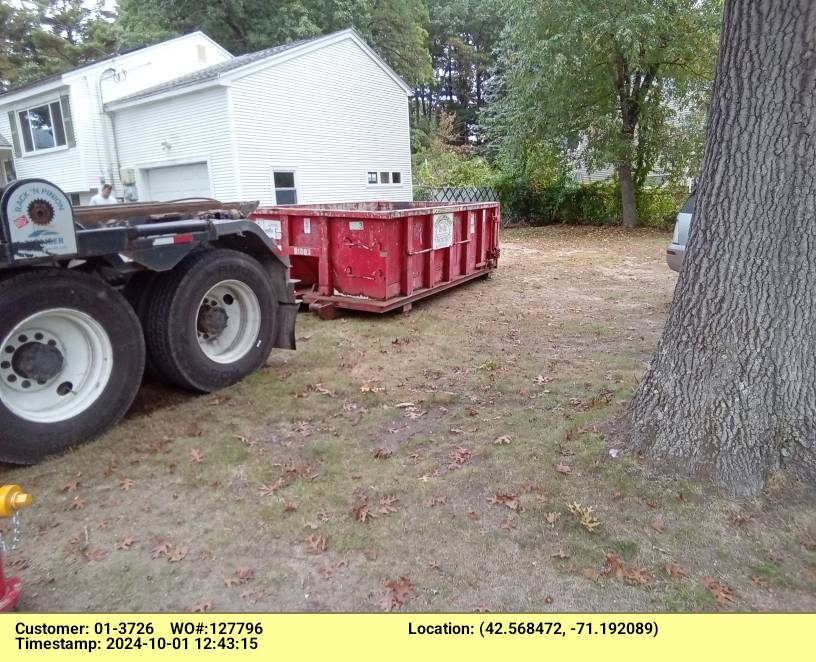 10 yard dumpster rental delivered in Tewksbury, MA for a garage clean-out.