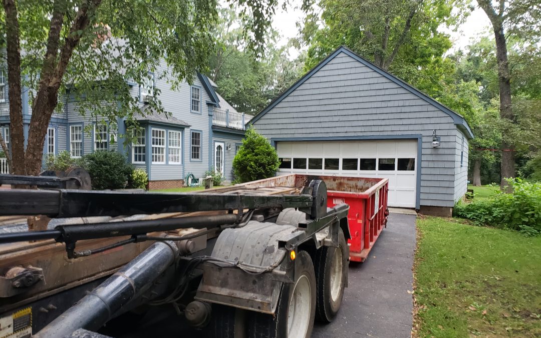 10 yard dumpster rental in Topsfield, MA. Dumpster with a 1.5 ton max for garbage clean out job.