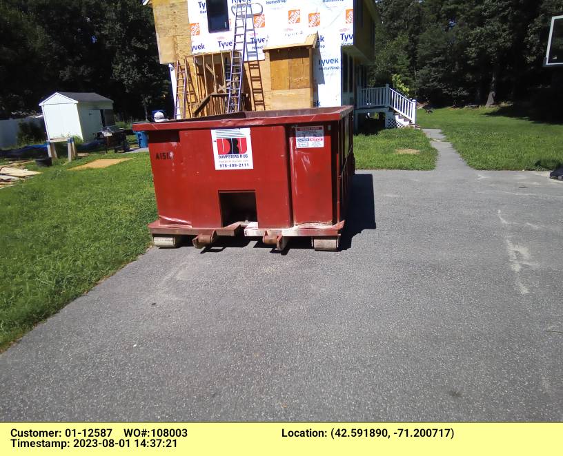 15 yard dumpster rental, with a 2 ton weight limit delivered in Tewksbury, MA for a construction project.
