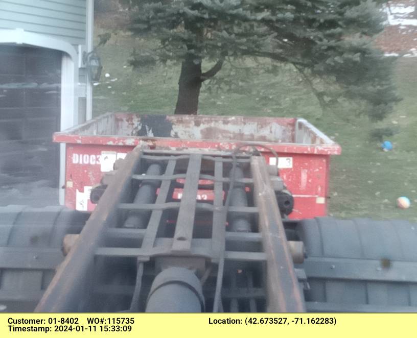 10 yard dumpster with a 1 ton weight limit delivered in Andover, MA for a garage clean out.
