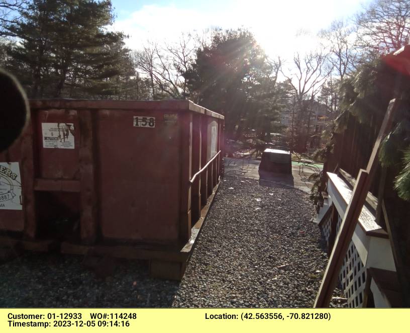 15 yard dumpster rental delivered in Beverly, MA for a roofing project.