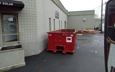 30 yard dumpster rental swapped out at a construction site in Woburn, MA