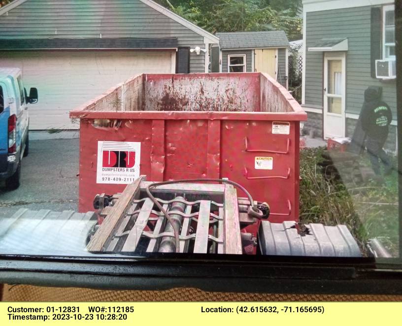 30 yard dumpster rental with a 5 ton max delivered in Reading, MA for a construction project.