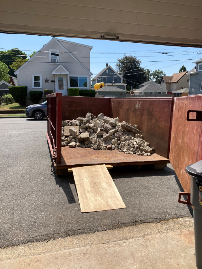 In Peabody, a 15 yard ABC dumpster for a backyard masonry project.