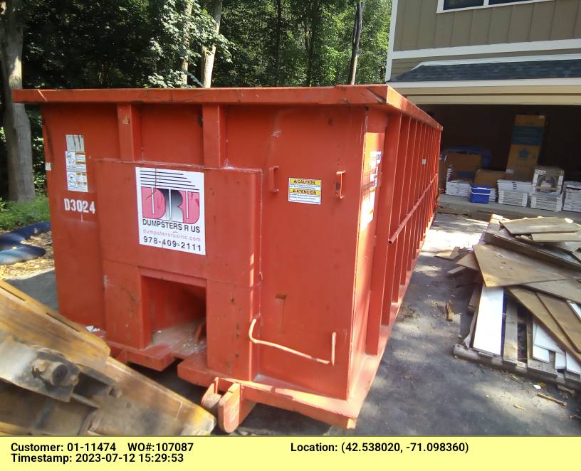 30 yard dumpster rental, with a 5 ton max, delivered to a house in Reading, MA for a garage clean-out.