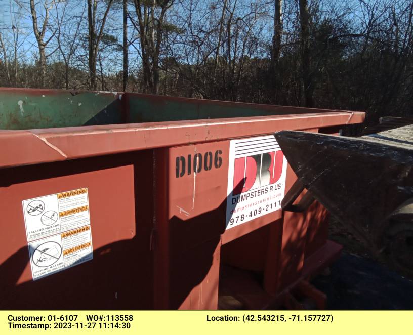 10 yard dumpster rental with a 1.5 ton max delivered in Wilmington, MA for a construction project.
