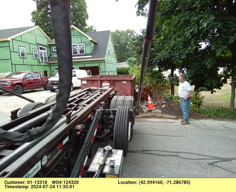 15 yard dumpster rental, with a 2 ton weight limit, delivered in Billerica, MA for a construction project.