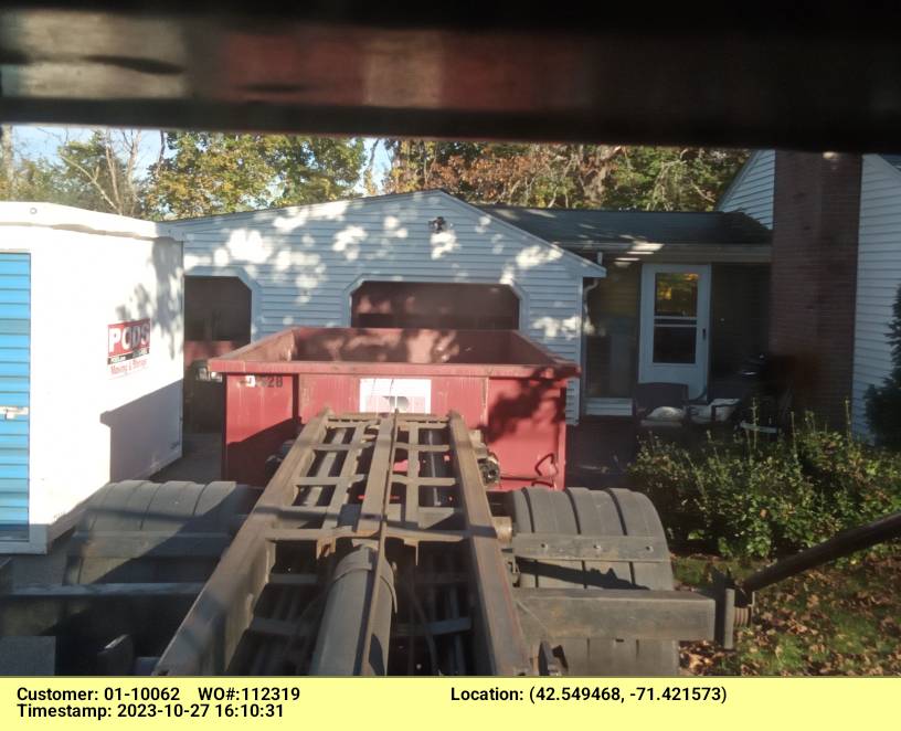 15 yard dumpster rental with a 2 ton weight limit delivered in Westford, MA for a garage clean-out.