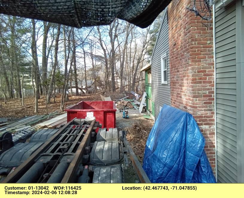 15 yard dumpster rental, with a 3 ton max, delivered in Melrose, MA for a construction project.