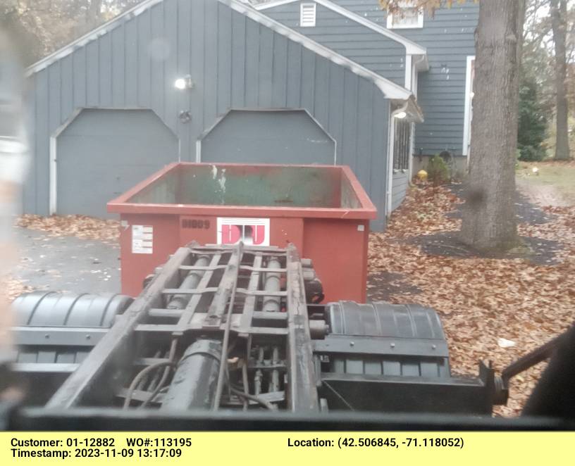 10 yard dumpster rental with a 1.5 ton max delivered in Reading, MA for a garage clean-out.
