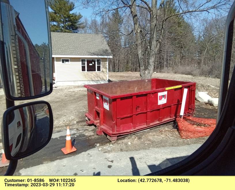15 yard dumpster rental, with a 2 ton weight limit, delivered in Nashua, NH for a construction project.