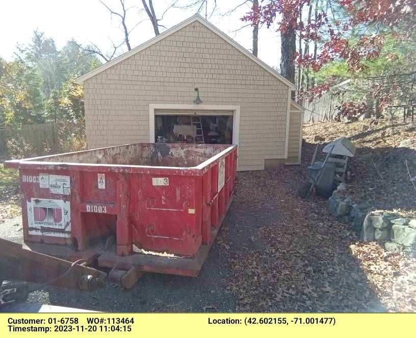 10 yard dumpster rental with a 1 ton weight limit delivered in Middleton, MA for a garage clean-out.
