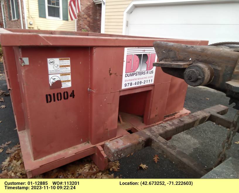 10 yard dumpster rental with a 1.5 ton max delivered in Andover, MA for a garage clean-out.