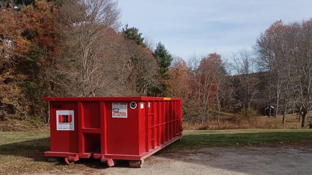 Dumpsters R Us, Inc 15 yard 2 ton roll off dumpster placed on a residential driveway in South Hampton NH for home remodeling debris