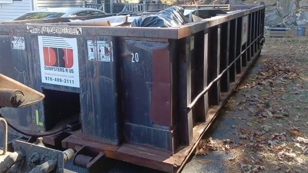 Dumpsters R Us 20-yard roll-off dumpster placed in a Tyngsboro MA driveway for residential home updates