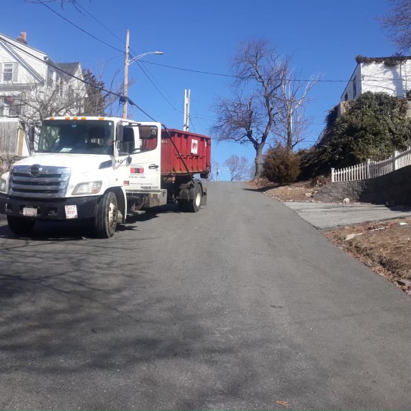 10 yard dumpster delivery with our 2011 Hino to Lynnfield, MA