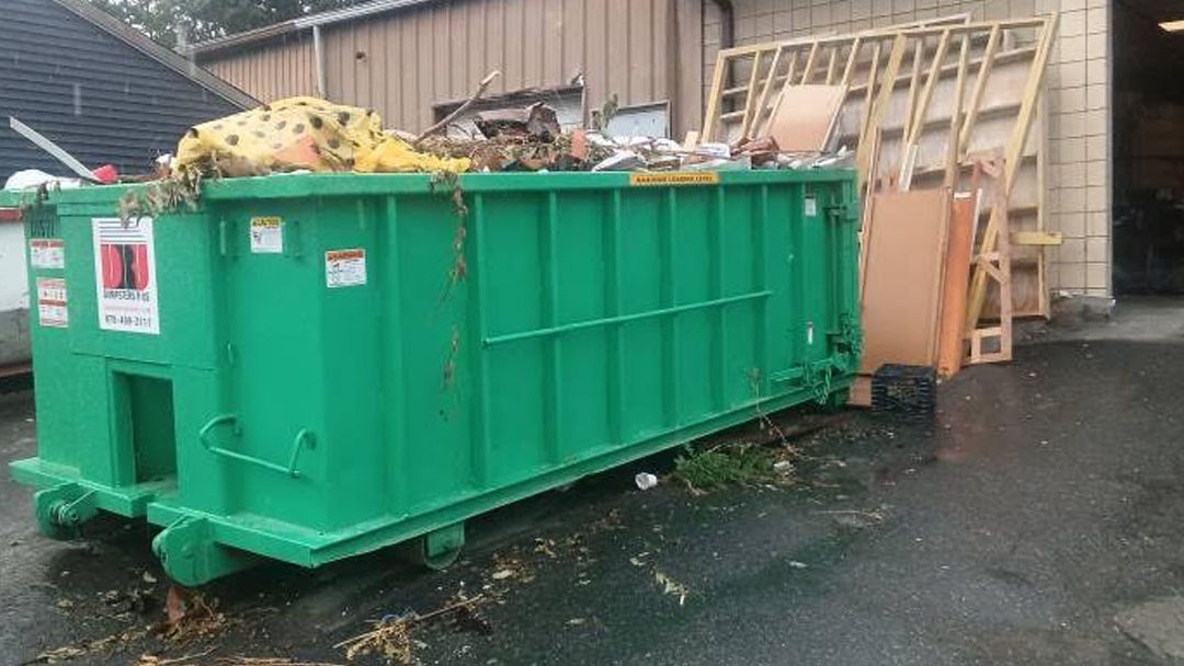 15-yard construction dumpster swap in Malden, MA