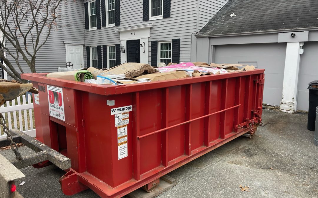 Picking up a 10 yard dumpster rental with a 1 1/2 ton max used for a new year clean out in Andover, MA.