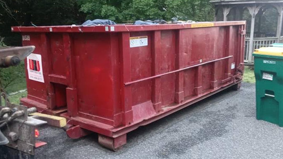 10-yard dumpster rental pickup after a residential remodeling project in Woburn, MA